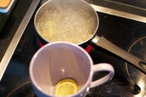 Boiling water, cardamon, & ginger.